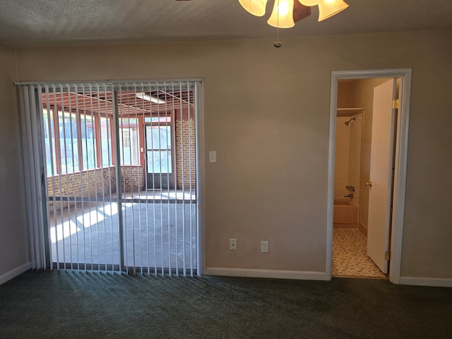 spare room with carpet flooring and baseboards