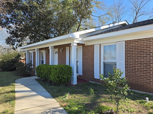 view of front of house featuring brick siding