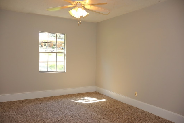 carpeted empty room with ceiling fan