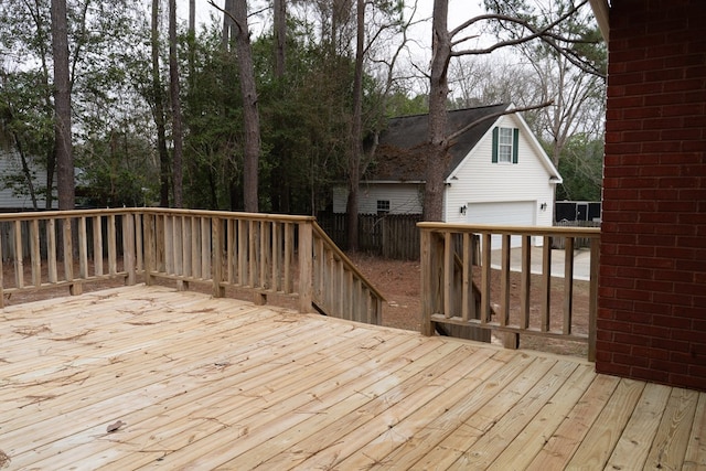 wooden deck with a garage