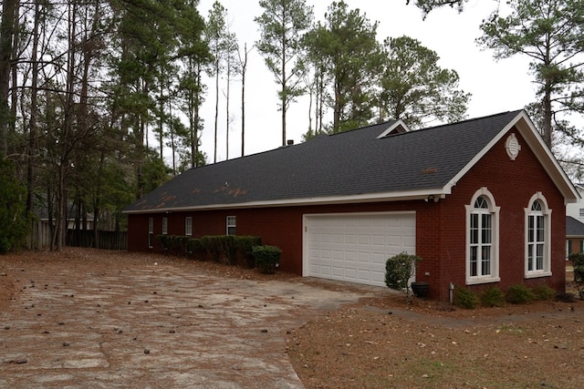 view of property exterior with a garage