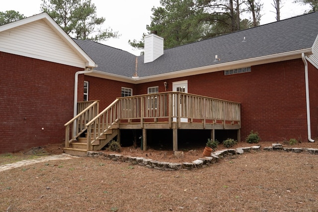 back of house featuring a deck