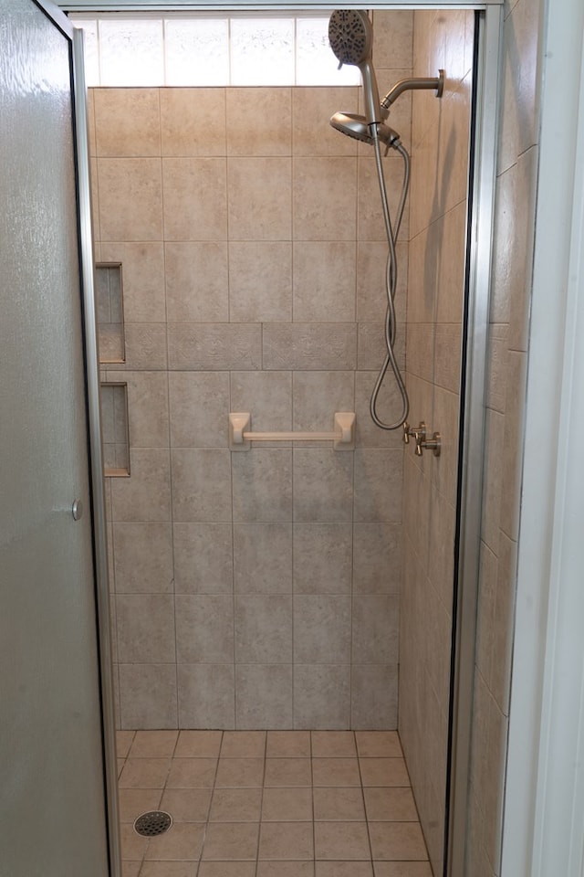 bathroom with a shower with shower door