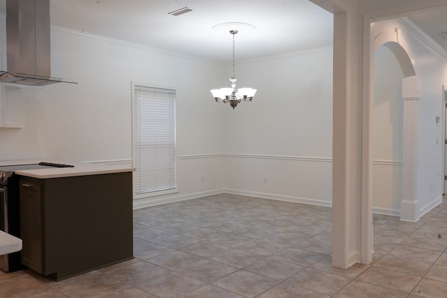 unfurnished dining area featuring crown molding, light tile patterned floors, and a notable chandelier