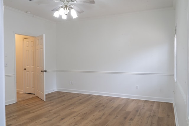 spare room with light hardwood / wood-style flooring, ornamental molding, and ceiling fan