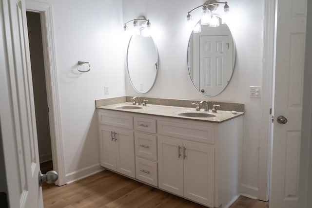 bathroom featuring vanity and hardwood / wood-style floors