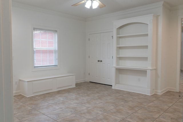 interior space with ornamental molding, built in features, ceiling fan, and light tile patterned flooring