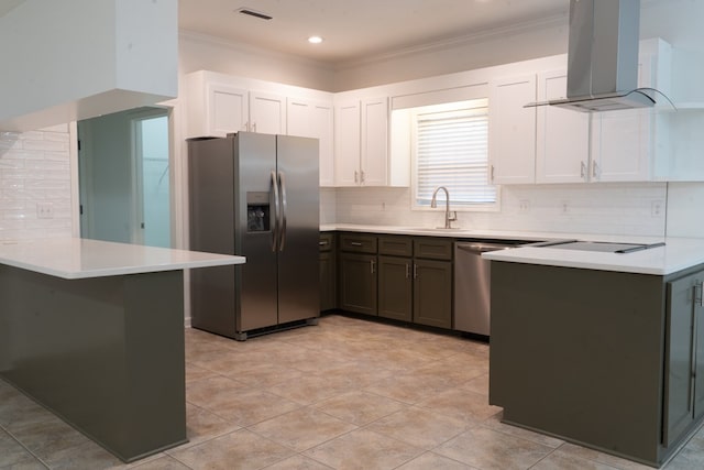 kitchen featuring sink, appliances with stainless steel finishes, white cabinetry, island exhaust hood, and kitchen peninsula