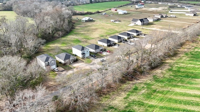 birds eye view of property featuring a rural view