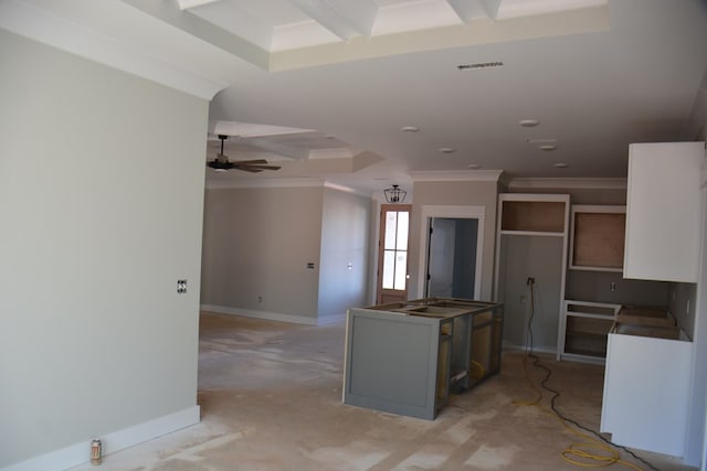 kitchen featuring beamed ceiling, white cabinetry, ceiling fan, and coffered ceiling