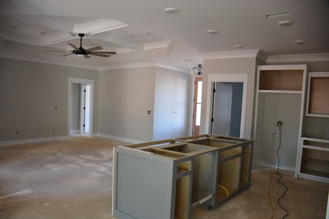 kitchen with beamed ceiling, crown molding, ceiling fan, and coffered ceiling