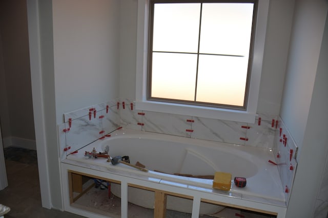 bathroom with a washtub