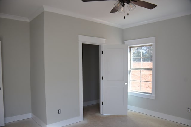 spare room with ceiling fan and crown molding