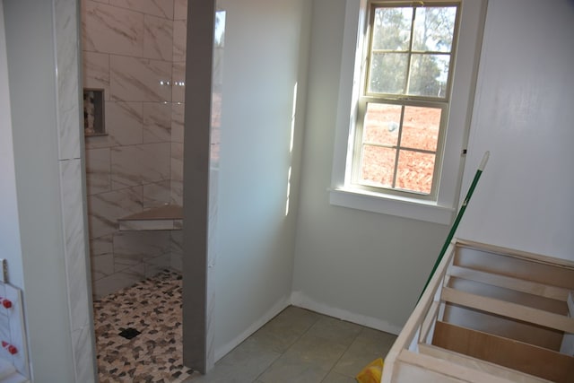 stairway with tile patterned flooring