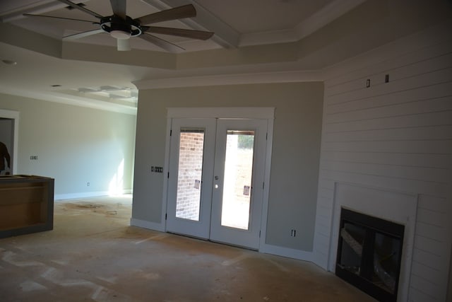 unfurnished living room with a fireplace, french doors, ceiling fan, and crown molding