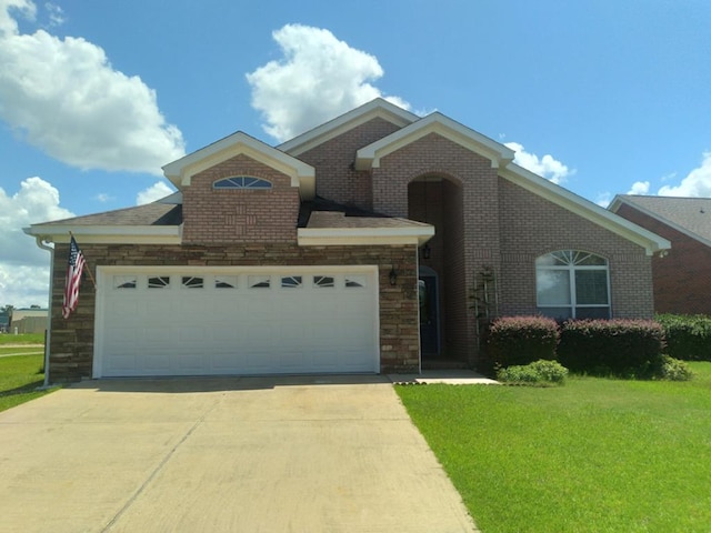 38 Vansant Pl, Dothan, AL 36301 - view of front of house with a garage, concrete driveway, a front yard, stone siding, and brick siding