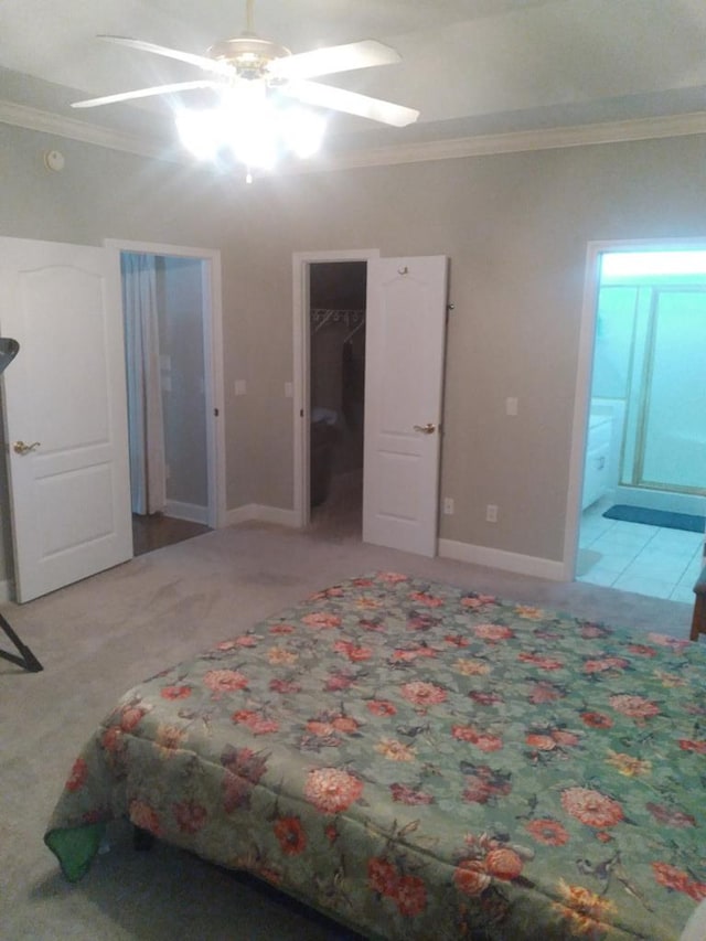 38 Vansant Pl, Dothan, AL 36301 - carpeted bedroom featuring crown molding, ensuite bathroom, a spacious closet, a ceiling fan, and baseboards