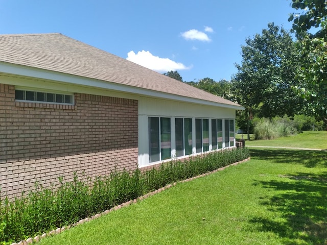 38 Vansant Pl, Dothan, AL 36301 - view of home's exterior with brick siding, a yard, and roof with shingles