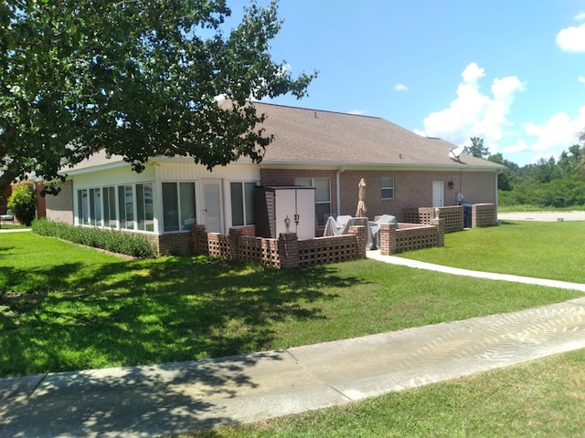 38 Vansant Pl, Dothan, AL 36301 - back of house featuring brick siding, a yard, central air condition unit, and a patio area