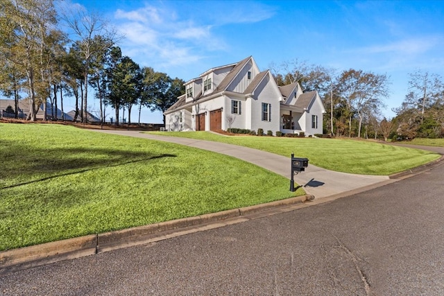 view of front of house featuring a garage and a front yard