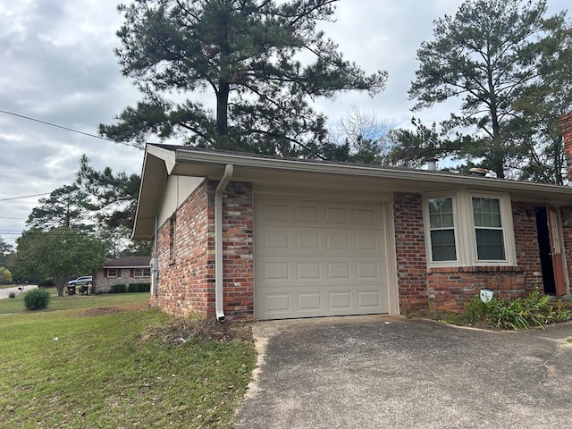 view of property exterior featuring a lawn and a garage