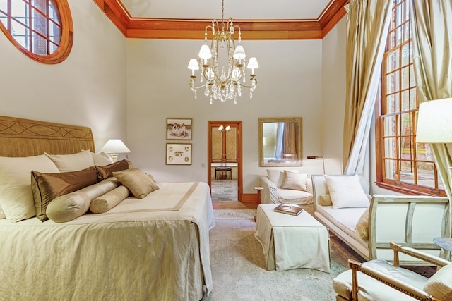 bedroom with a chandelier, multiple windows, and crown molding