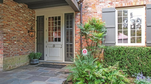 view of exterior entry featuring a wall mounted AC