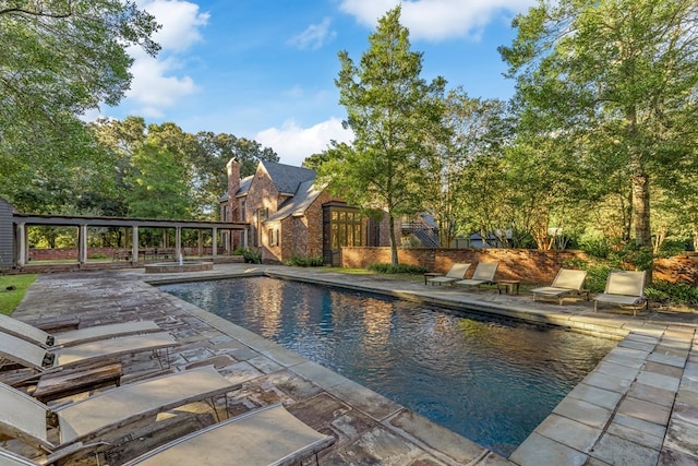 view of swimming pool with a patio area