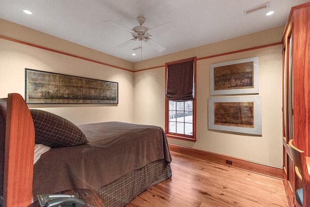 bedroom featuring light hardwood / wood-style floors and ceiling fan