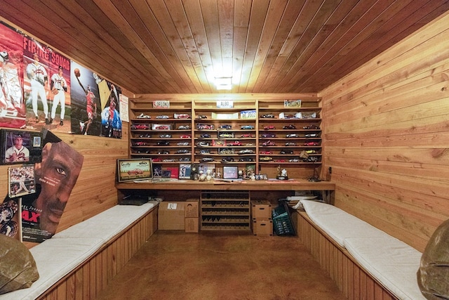 office space with wood walls and wood ceiling