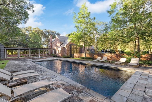 view of swimming pool featuring a patio area