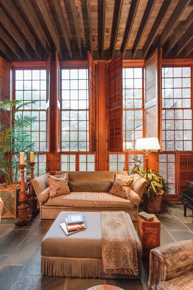 living room with beam ceiling and wooden ceiling