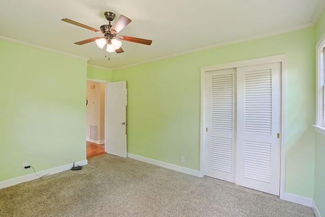 1810 Northside Dr, Dothan, AL 36303 - unfurnished bedroom with carpet floors, a closet, ornamental molding, baseboards, and a ceiling fan
