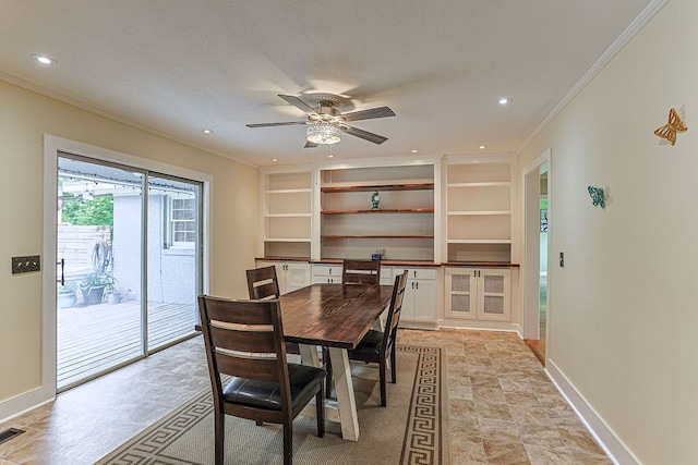 1810 Northside Dr, Dothan, AL 36303 - dining area featuring crown molding, built in features, baseboards, ceiling fan, and light stone finish floors