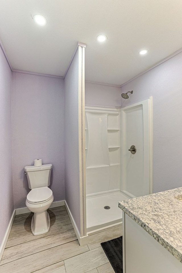 1810 Northside Dr, Dothan, AL 36303 - full bathroom featuring wood finished floors, walk in shower, toilet, baseboards, and recessed lighting