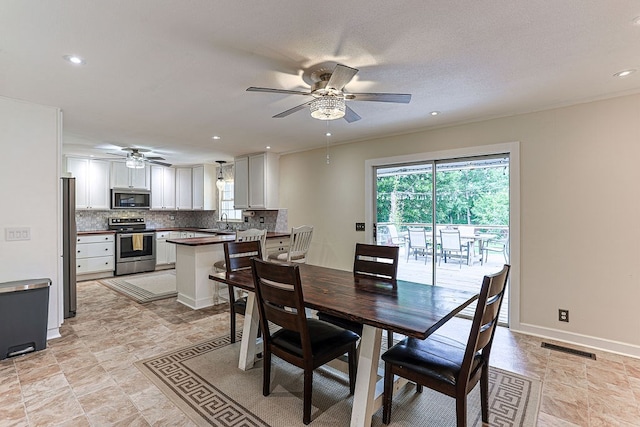 1810 Northside Dr, Dothan, AL 36303 - dining space featuring ceiling fan, recessed lighting, baseboards, and light stone finish flooring