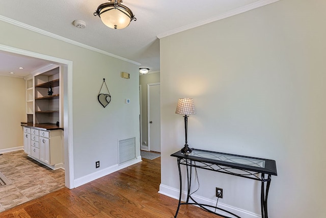 1810 Northside Dr, Dothan, AL 36303 - hall featuring baseboards, ornamental molding, and light wood finished floors
