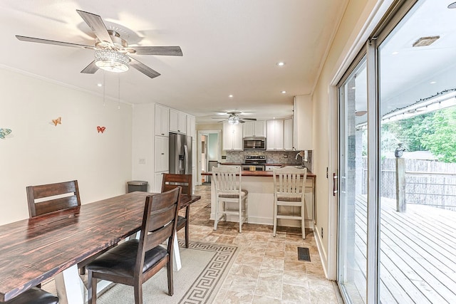 1810 Northside Dr, Dothan, AL 36303 - dining area featuring ceiling fan, light stone finish floors, and recessed lighting