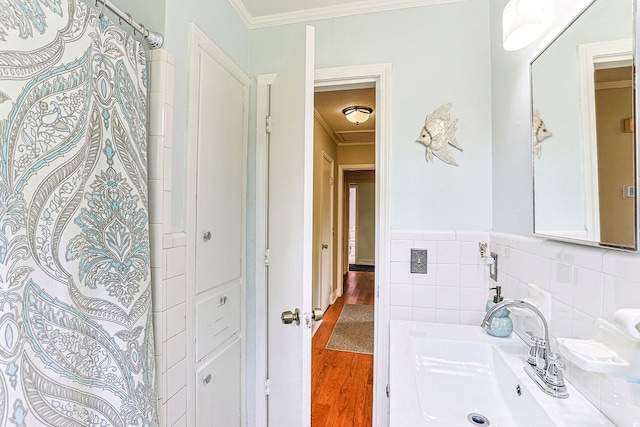 1810 Northside Dr, Dothan, AL 36303 - bathroom with crown molding, a sink, wood finished floors, and wainscoting