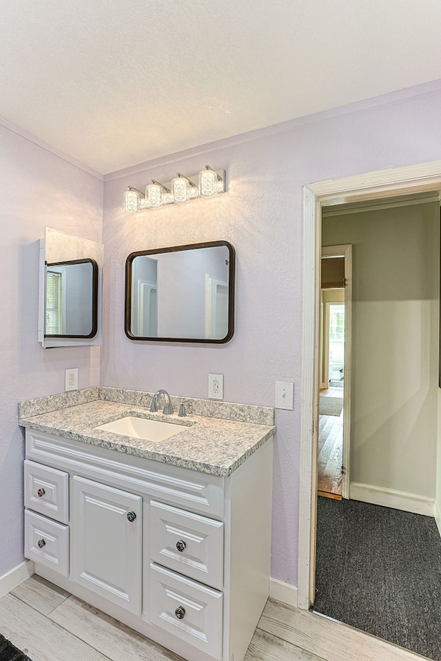 1810 Northside Dr, Dothan, AL 36303 - bathroom featuring baseboards, vanity, and wood finished floors