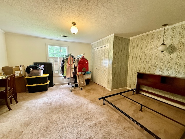 152 W Cox St, Slocomb, AL 36375 - carpeted bedroom with crown molding, baseboards, a closet, and a textured ceiling