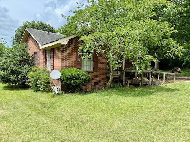 152 W Cox St, Slocomb, AL 36375 - view of side of property with brick siding, a yard, and a shingled roof