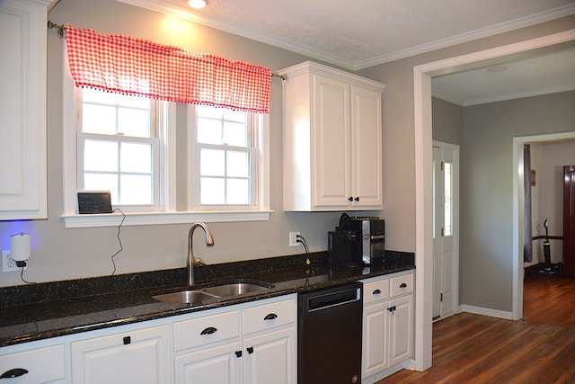 kitchen with dark stone countertops, white cabinets, dishwasher, a sink, and dark wood finished floors