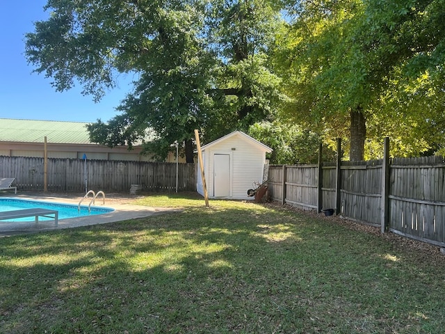 view of yard featuring a fenced backyard, a fenced in pool, a storage unit, and an outdoor structure
