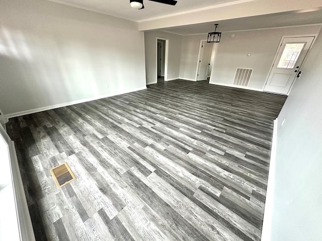 unfurnished living room featuring ceiling fan, crown molding, and hardwood / wood-style flooring