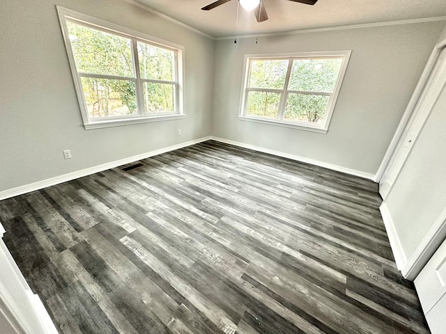 unfurnished room with ceiling fan, dark hardwood / wood-style floors, and crown molding