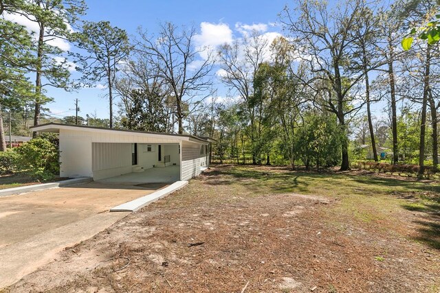 exterior space featuring a carport