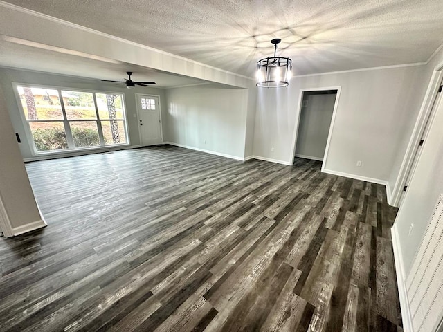 interior space featuring dark hardwood / wood-style flooring, ceiling fan with notable chandelier, a textured ceiling, and ornamental molding