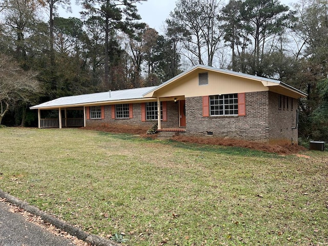 single story home with central air condition unit and a front lawn