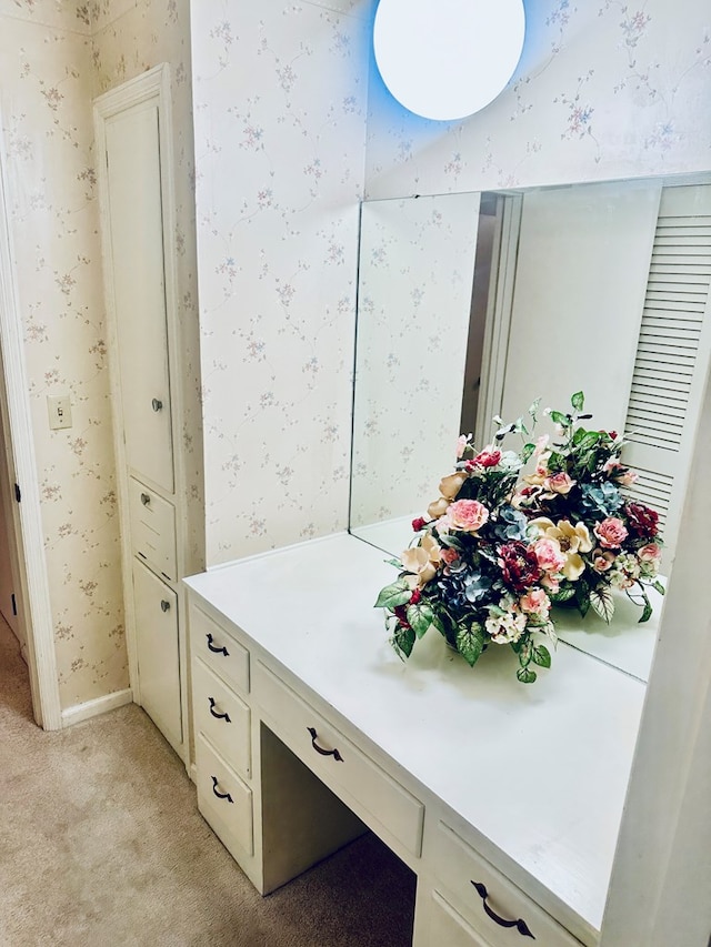 bathroom with wallpapered walls